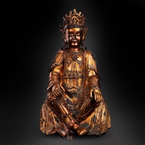 A 16th-17th century Ming Dynasty lacquered and gilded seated Guanyin statue