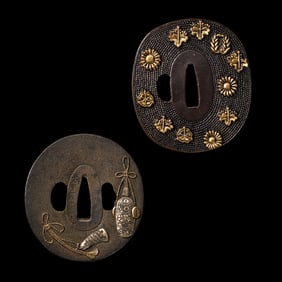 Sword guards with family crests from the 18th-19th century Edo period in Japan.