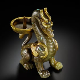 A Gold and Turquoise-Inlaid Jade Chimera Candlestick with Inscription Late Warring States to Early
