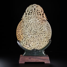 Jade disc with dragon design and inlaid with a jasper base, dating from the 1st-2nd century AD,