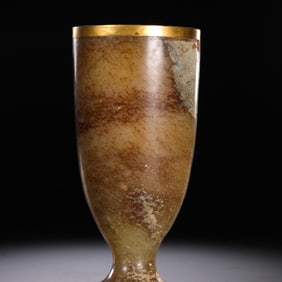 A Hetian jade cup with gold plating from the Han Dynasty (1st-3rd centuries AD).
