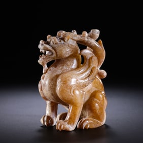 A mythical beast made of Hetian white jade from the 1st-2nd century AD, dating back to the Han