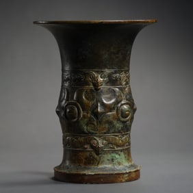 A Bronze Ritual Wine Vessel (Gu) with Taotie Motif, Late Shang Dynasty China, circa 13th–11th