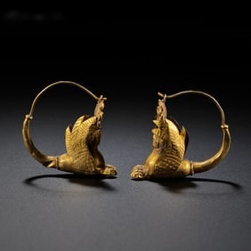 A pair of pure gold human face earrings from West Asia, dating back to the 4th century AD or