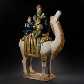 A tricolor camel statue of a Central Asian man from the Tang Dynasty (7th-8th centuries AD).