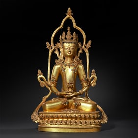 Gilt bronze seated Avalokiteshvara statue inlaid with gemstones from Nepal, dating from the 13th to