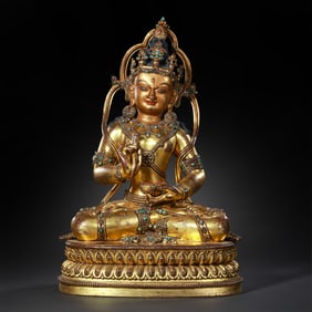 Gilt bronze seated Avalokiteshvara statue inlaid with gemstones from Nepal, dating from the 13th to