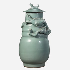 A 12th-century celadon covered jar with molded dragon design from the Song Dynasty in China.