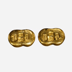 A pair of pure gold ingots from the Qing Dynasty in China, dating from the 18th to 19th centuries.