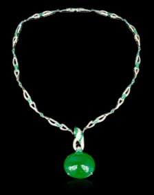 GUILD A magnificent 65-carat natural emerald set in 18K platinum and diamonds for an evening