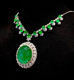 GUILD's enormous 19-carat natural emerald set in 18K platinum and diamonds for an evening gown