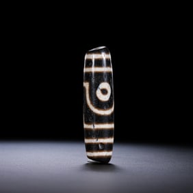 A RARE AND MAGNIFICENT 'TWO-EYED' DZI BEADHIMALAYAN REGION, TIBET, ANCIENT TO MEDIEVAL PERIOD