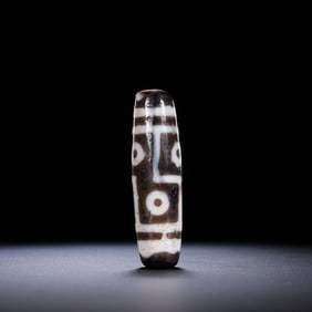 A RARE AND MAGNIFICENT 'SIX-EYED' DZI BEADHIMALAYAN REGION, TIBET, ANCIENT TO MEDIEVAL PERIOD