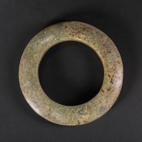 A RARE AND MAGNIFICENT LARGE GREENISH-YELLOW JADE RITUAL DISC,HUANHONGSHAN CULTURE, NEOLITHIC PERIOD