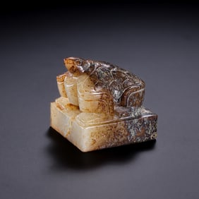 A RARE AND EXQUISITE WHITE JADE 'TORTOISE' KNOT SEALWARRING STATES PERIOD TO HAN DYNASTY (C. 3RD