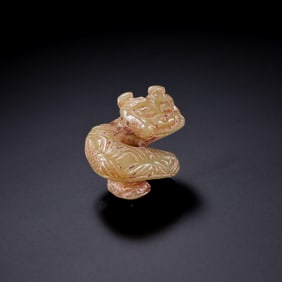 A RARE AND IMPORTANT YELLOW JADE 'SPIRAL' DRAGON PENDANTNEOLITHIC PERIOD, PROBABLY HONGSHAN CULTURE