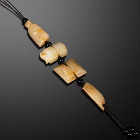 A RARE GROUP OF FOUR NEPHRITE JADE 'PROTECTIVE' AMULETS HAN DYNASTY OR LATER 2ND CENTURY BC – 2ND