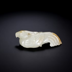 A RARE WHITE JADE FIGURE OF A RESTING PHOENIXWARRING STATES PERIOD (C. 475–221 BC)