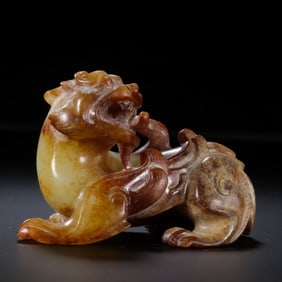 A RARE AND EXCEPTIONALLY DYNAMIC WHITE JADE WINGED MYTHICAL BEAST,BIXIEWARRING STATES PERIOD