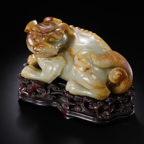 A MAGNIFICENT AND SUBSTANTIAL WHITE JADE FIGURE OF A RECUMBENT MYTHICAL BEASTQING DYNASTY, QIANLONG