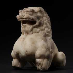 A POWERFUL AND RARE FRAGMENTARY WHITE MARBLE FIGURE OF A SEATED LIONTANG DYNASTY (618-907 AD)