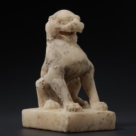 A RARE AND VIGOROUS WHITE MARBLE FIGURE OF A SEATED LIONTANG DYNASTY (618-907 AD)