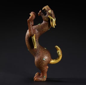A SPECTACULAR GOLD-INLAID AND GEM-SET HETIAN JADE BIPEDAL MYTHICAL BEASTWARRING STATES PERIOD