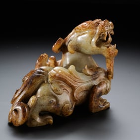 A RARE AND IMPORTANT WHITE JADE FIGURE OF A MYTHICAL BEAST,BIXIEWARRING STATES PERIOD (C. 475 –