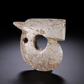 A RARE AND MONUMENTAL 'CHICKEN-BONE' WHITE JADE 'EMBRYONIC DRAGON' (ZHULONG)NEOLITHIC PERIOD,