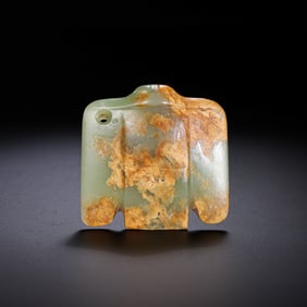 A RARE AND POTENT GREEN JADE FIGURE OF AN OWLHONGSHAN CULTURE, NEOLITHIC PERIOD (C. 3500-3000 BC)