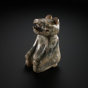 A MAGNIFICENT AND SUBSTANTIAL WHITE JADE FIGURE OF A SEATED MYTHICAL BEASTHAN DYNASTY (206 BC –