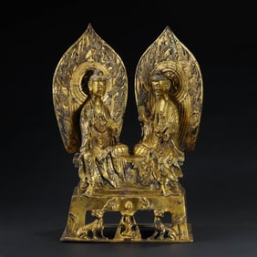AN EXCEPTIONALLY RARE AND IMPORTANT LARGE GILT-BRONZE FIGURE OF 'SHAKYAMUNI AND