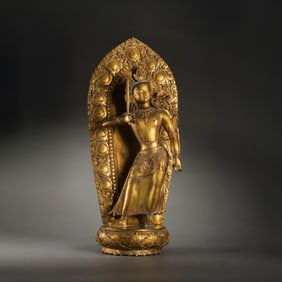 A MAGNIFICENT AND MONUMENTAL GILT-BRONZE FIGURE OF STANDING MANJUSHRIMARK AND PERIOD OF QIANLONG