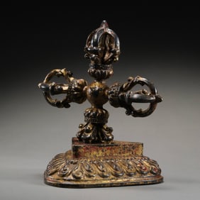 A RARE AND MAGNIFICENT COLD-GILDED BRONZE 'VISVAVAJRA' AND ORIGINAL LOTUS BASETIBET, 17TH - 18TH