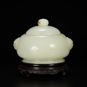 A RARE AND EXQUISITELY CARVED WHITE JADE COVERED JAR WITH LION-MASK HANDLESQING DYNASTY, QIANLONG