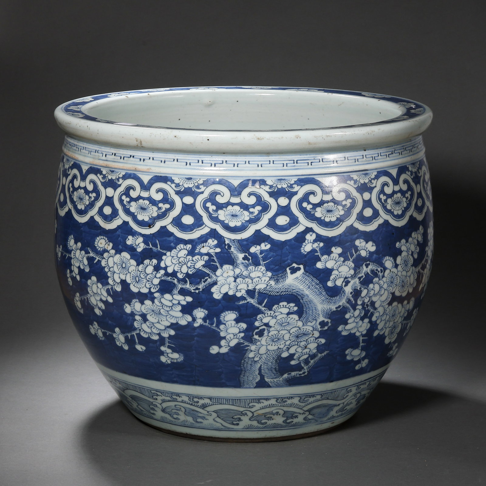 A LARGE BLUE AND WHITE 'PRUNUS' FISH BOWLQING DYNASTY, 18TH/19TH CENTURY (1 of 11)