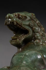 A RARE AND MAGNIFICENT MONUMENTAL GREEN JADE FIGURE OF A SEATED LIONMING / QING DYNASTY, 17TH