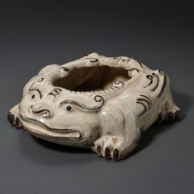 A RARE CIZHOU-TYPE WHITE-GLAZED AND BLACK-PAINTED 'LION' WATER POTSONG DYNASTY (960–1279 AD)