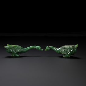 RARE AND MAGNIFICENT PAIR OF SPINACH-GREEN JADE 'GOOSE' FIGURESQING DYNASTY, QIANLONG PERIOD