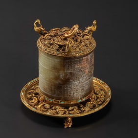 A MAGNIFICENT AND HIGHLY IMPORTANT GOLD-MOUNTED HETIAN WHITE JADE 'MYTHICAL BEAST & XUAN BIRD' CUP,