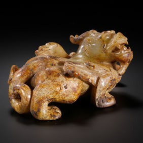 A MONUMENTAL AND POWERFULLY CARVED WHITE JADE WINGED MYTHICAL BEAST,BIXIEWARRING STATES PERIOD