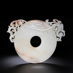 A RARE AND MAGNIFICENT OPENWORK 'DRAGON AND PHOENIX' JADEBI DISCWARRING STATES PERIOD (C. 475–221