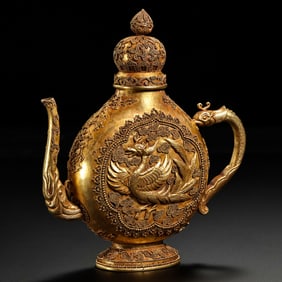 A MAGNIFICENT AND EXCEPTIONALLY RARE SOLID GOLD 'PHOENIX' EWERTANG DYNASTY (618–907 AD)