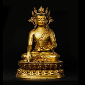 A MAGNIFICENT AND MONUMENTAL GILT-COPPER ALLOY FIGURE OF A CROWNED SHAKYAMUNI BUDDHATIBETO-CHINESE,