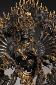 A RARE AND POWERFUL PARCEL-GILT BRONZE FIGURE OF A WRATHFUL VAJRA DEITYTIBET, 15TH – 16TH CENTURY