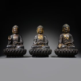 A RARE AND MAGNIFICENT SET OF THREE GILT-BRONZE FIGURES OF THE BUDDHAS OF THE THREE TIMESMING