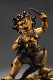 MAGNIFICENT AND POWERFULLY CAST IMPERIAL GILT-BRONZE FIGURE OF A WRATHFUL DEITY, POSSIBLY