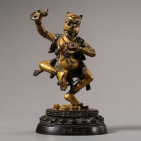 A RARE AND FINELY CAST IMPERIAL GILT-BRONZE FIGURE OF RIKSHA-MUKHA DAKINIQIANLONG SEVEN-CHARACTER