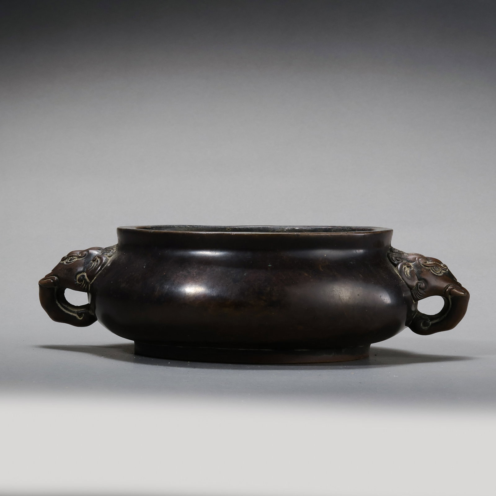 A RARE AND EXCEPTIONALLY DENSE BRONZE 'LION-ELEPHANT' HANDLED CENSERMARK OF XUANDE, MING DYNASTY (1 of 11)