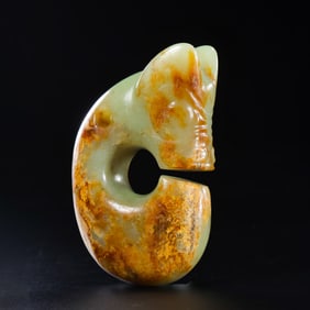 A RARE YELLOW JADE 'PIG-DRAGON' (ZHULONG)HONGSHAN CULTURE, NEOLITHIC PERIOD (C. 3500-3000 BC)